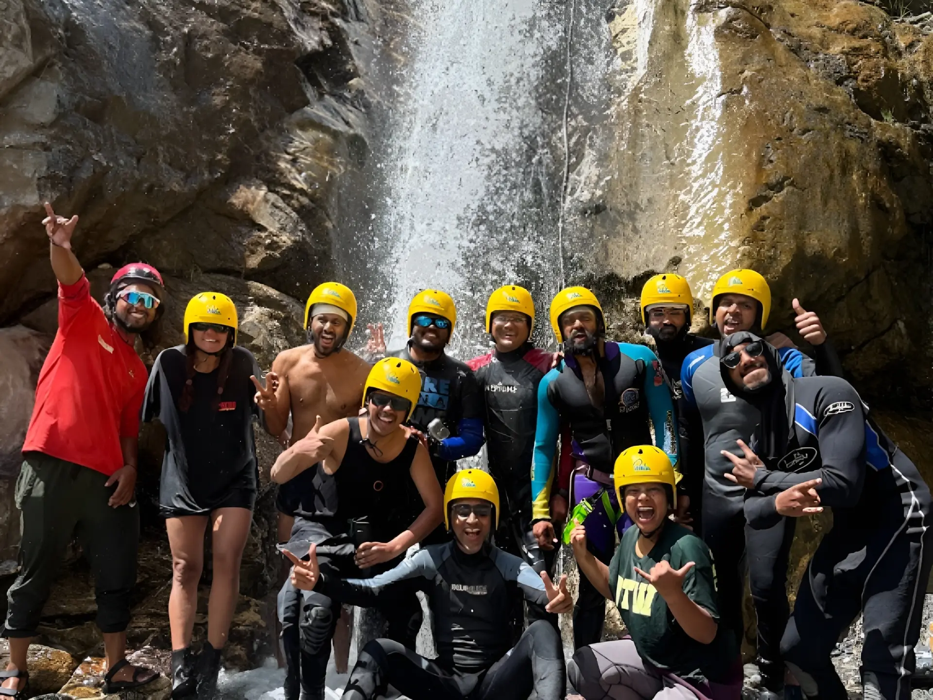 Zanskar River rafting group under a Himalayan waterfall in Ladakh