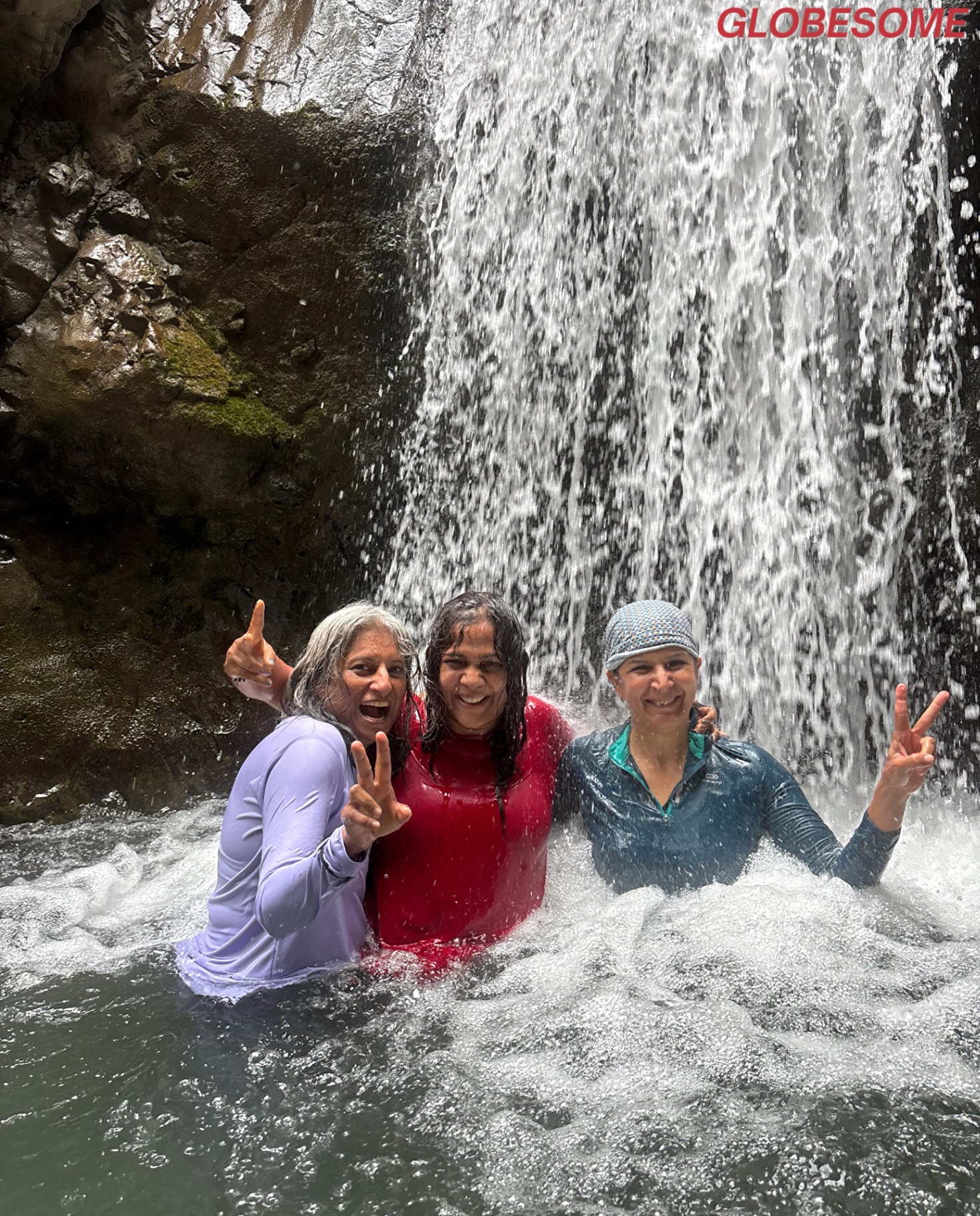 Under the waterfall