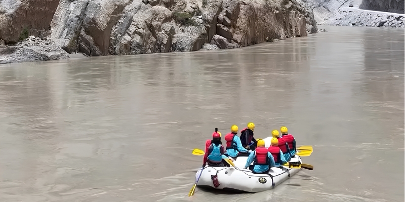 Rafters on the Ganga in a canyon during a Rishikesh river rafting expedition