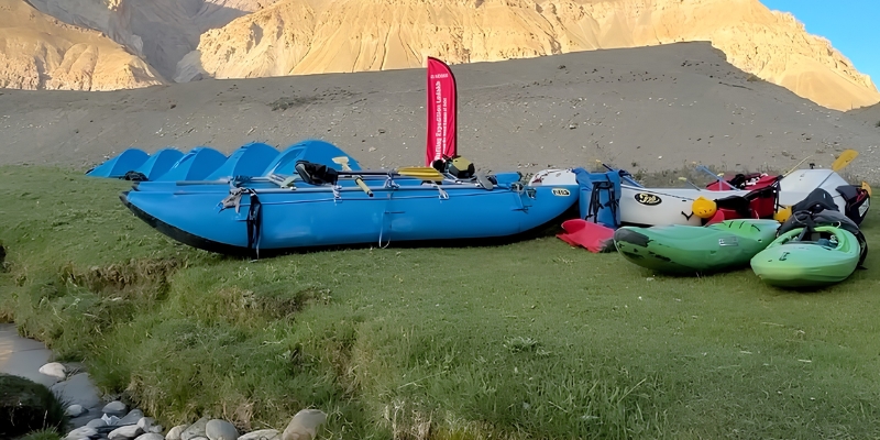 Riverside rafting camp in Uttarakhand at golden hour