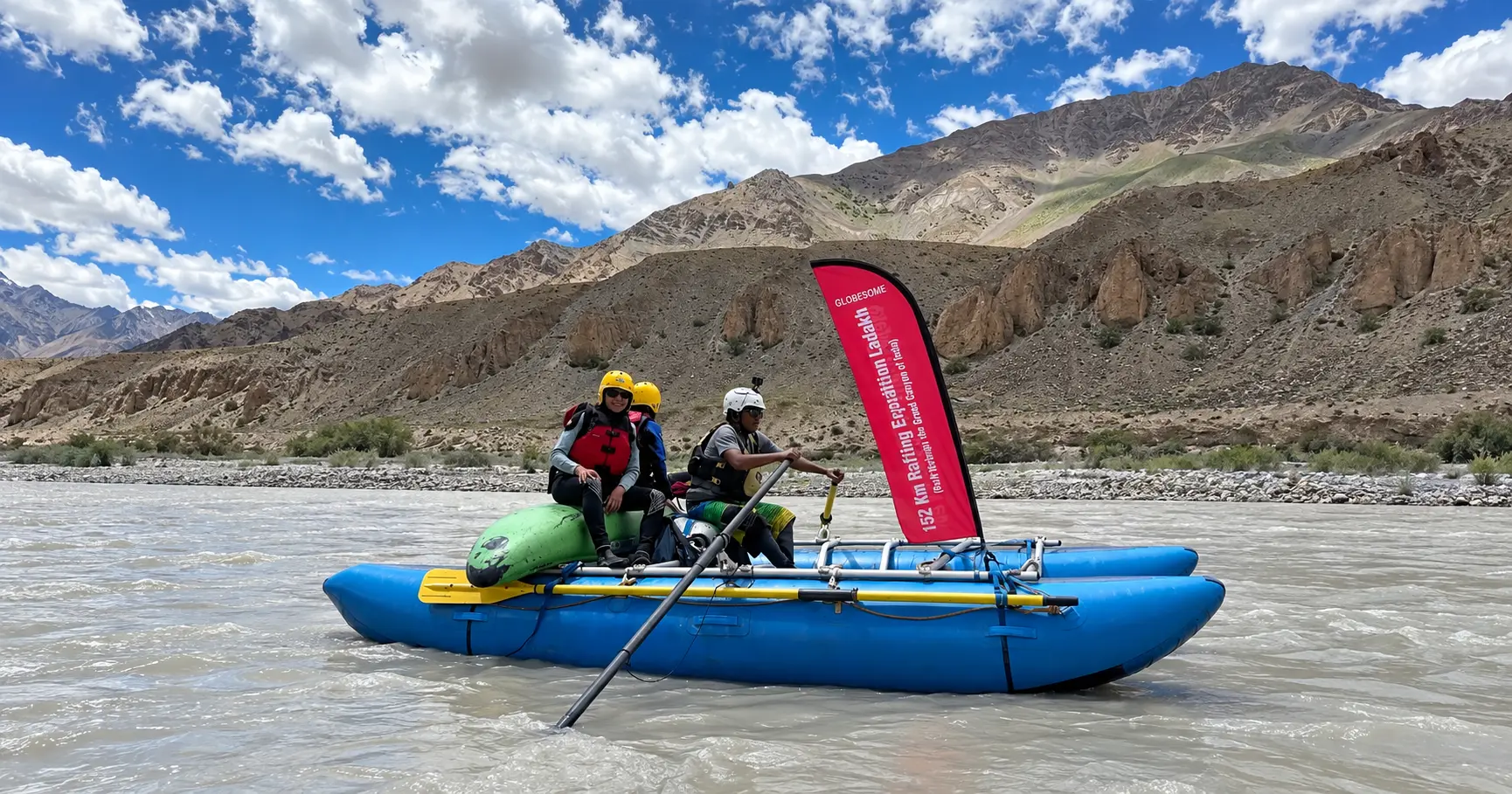 Rafters wearing helmets, life jackets, and secure outdoor clothing on a Himalayan river