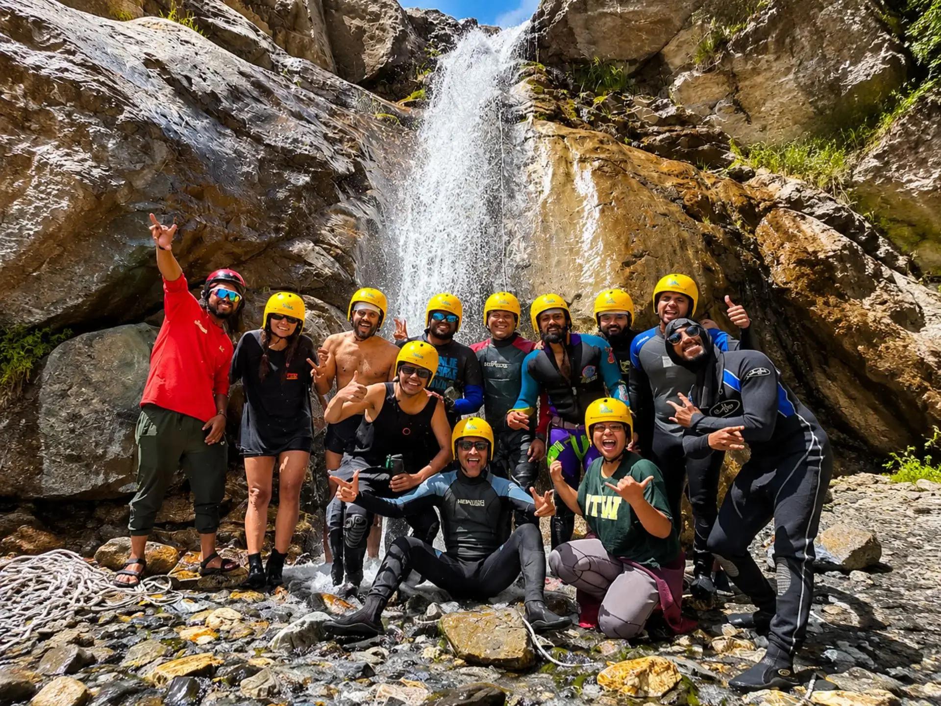 Rafting participant beside the Upper Alaknanda beneath Himalayan cliffs