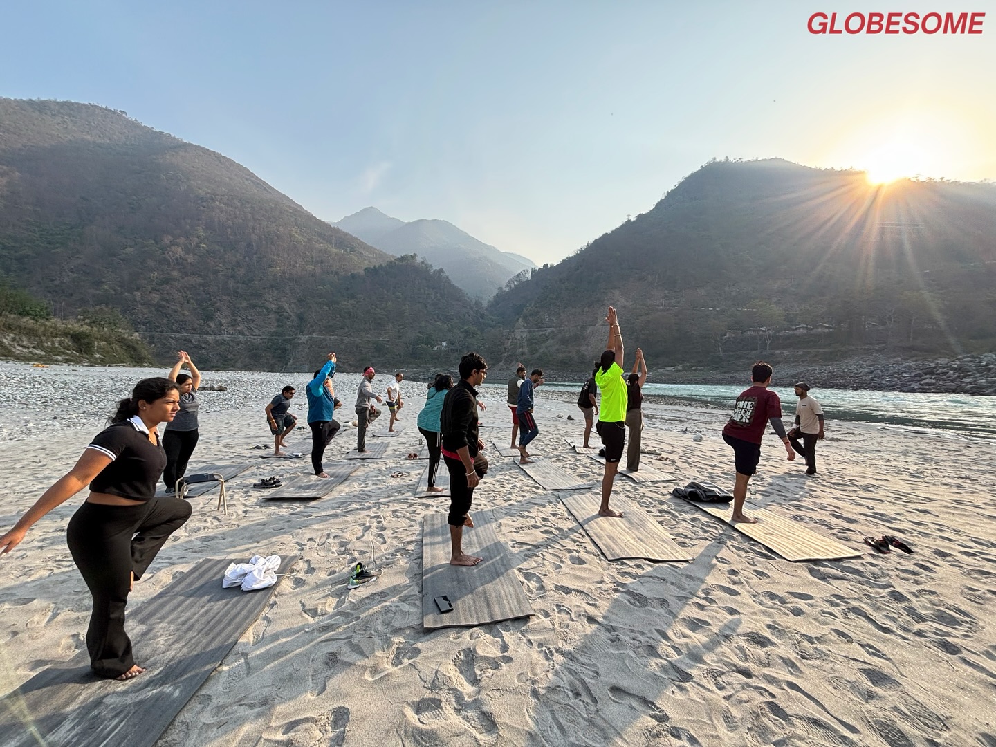Sunrise yoga on the sand