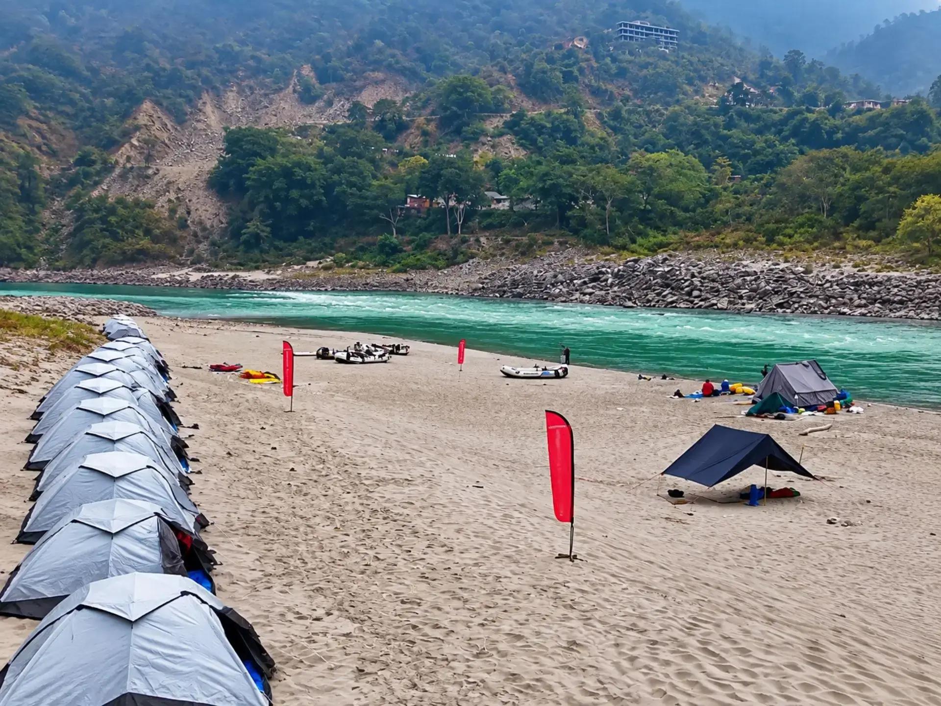Riverside tent camp beside the green Ganga near Rishikesh