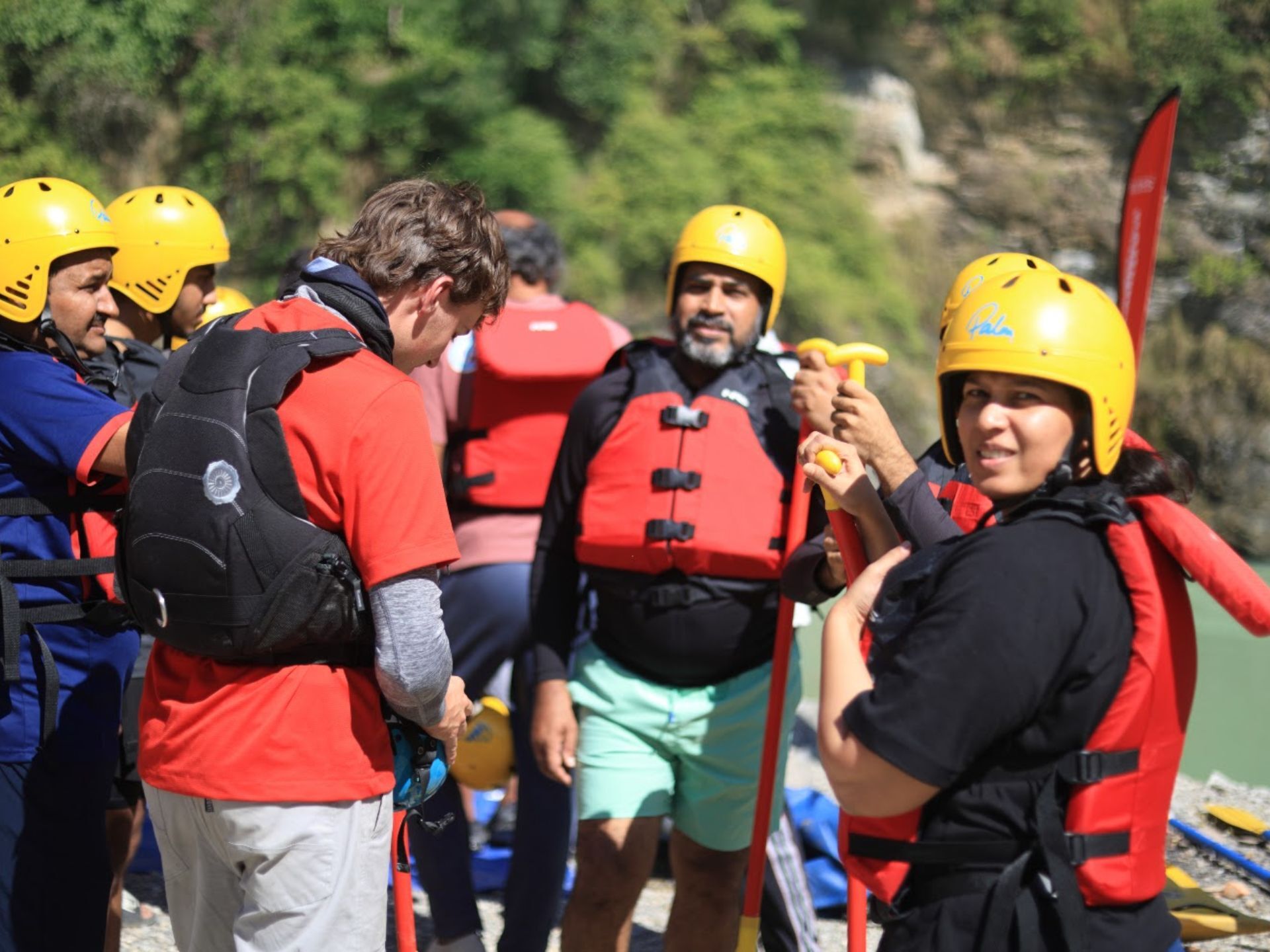Rafters in helmets and life jackets preparing for the 36 KM Kaudiyala to Neem Beach rafting trip