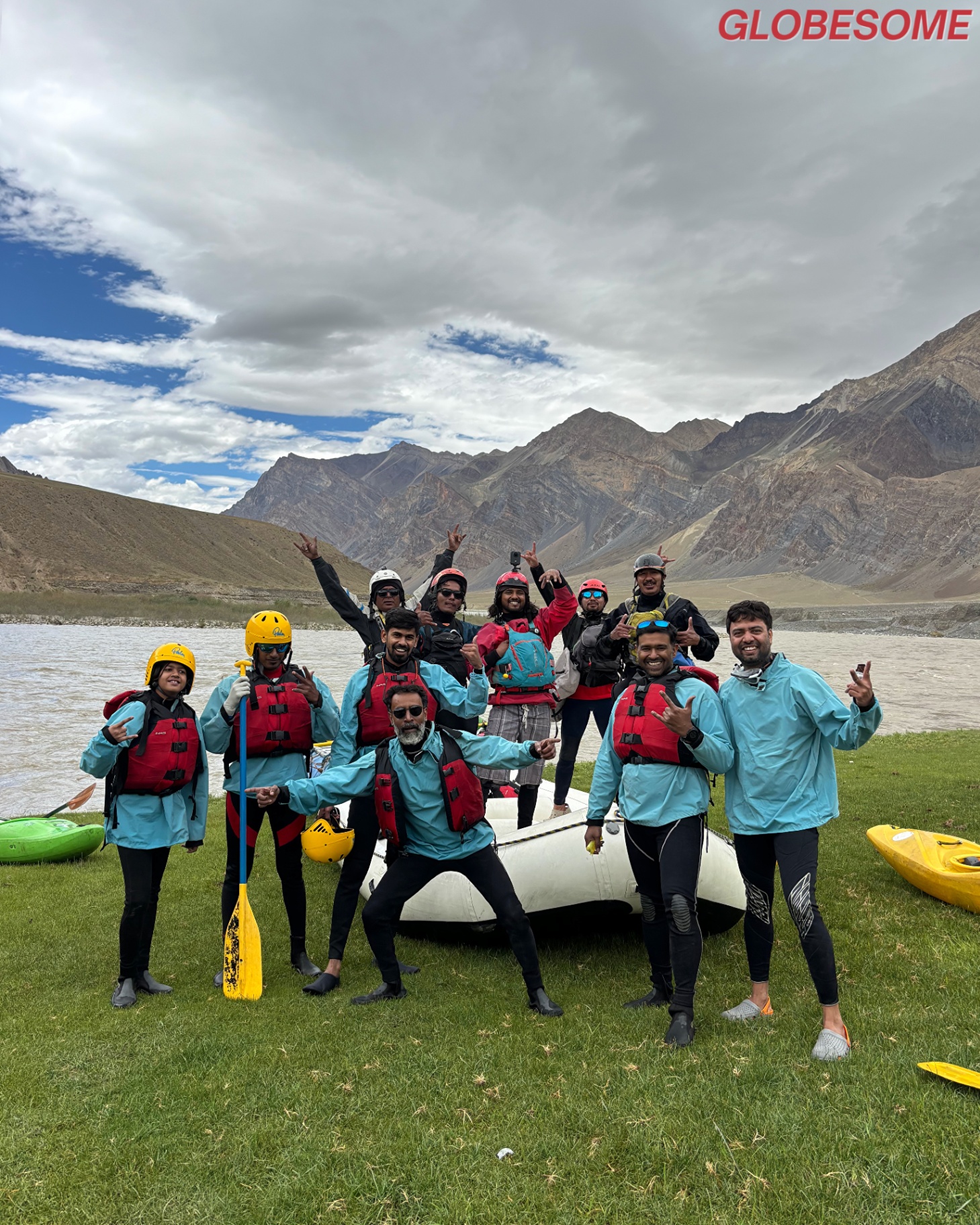 Globesome expedition team on the banks of a Himalayan river in Ladakh